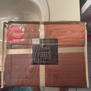 King size satin sheet set. New in packaging